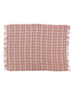 boucle throw blanket in a pink plaid pattern