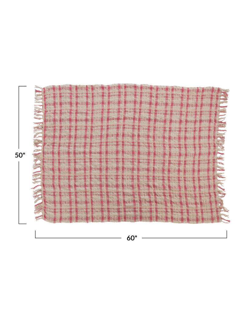 boucle throw blanket in a pink plaid pattern