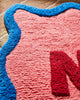 Amalie Nudie Bath Mat in hibiscus pink