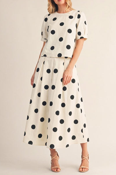 white skirt and top set with trendy black polka dots throughout