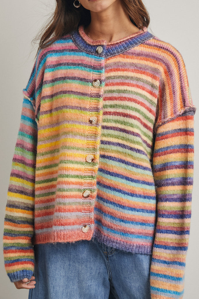 striped cardigan with a colorful rainbow design