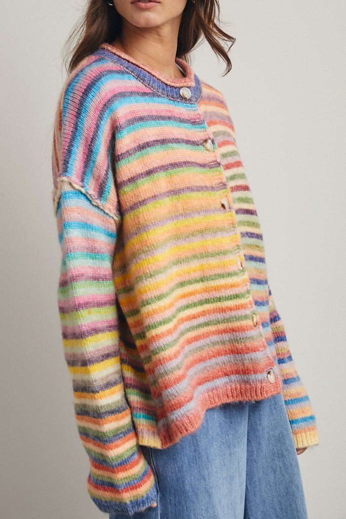 striped cardigan with a colorful rainbow design