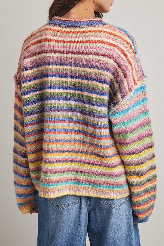 striped cardigan with a colorful rainbow design