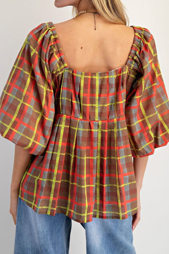 babydoll style top in a colorful plaid pattern