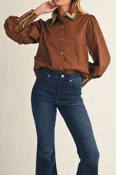 chocolate brown button down top with embroidered details on collar and wrist cuffs