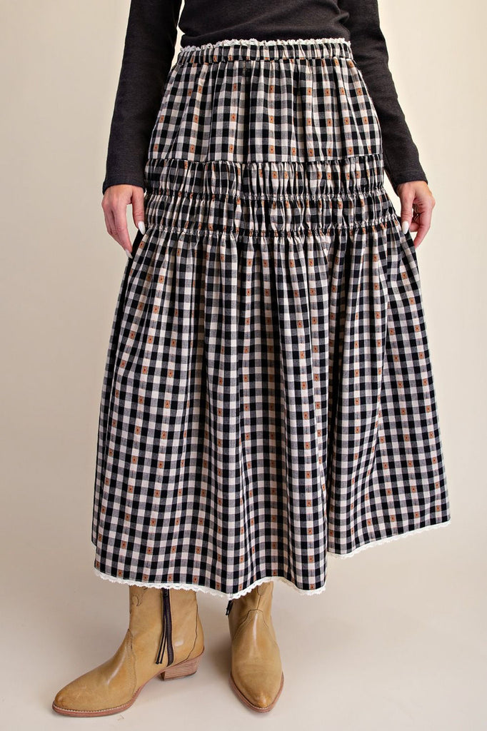 black and white plaid maxi skirt with smocked details and white lace trim. 