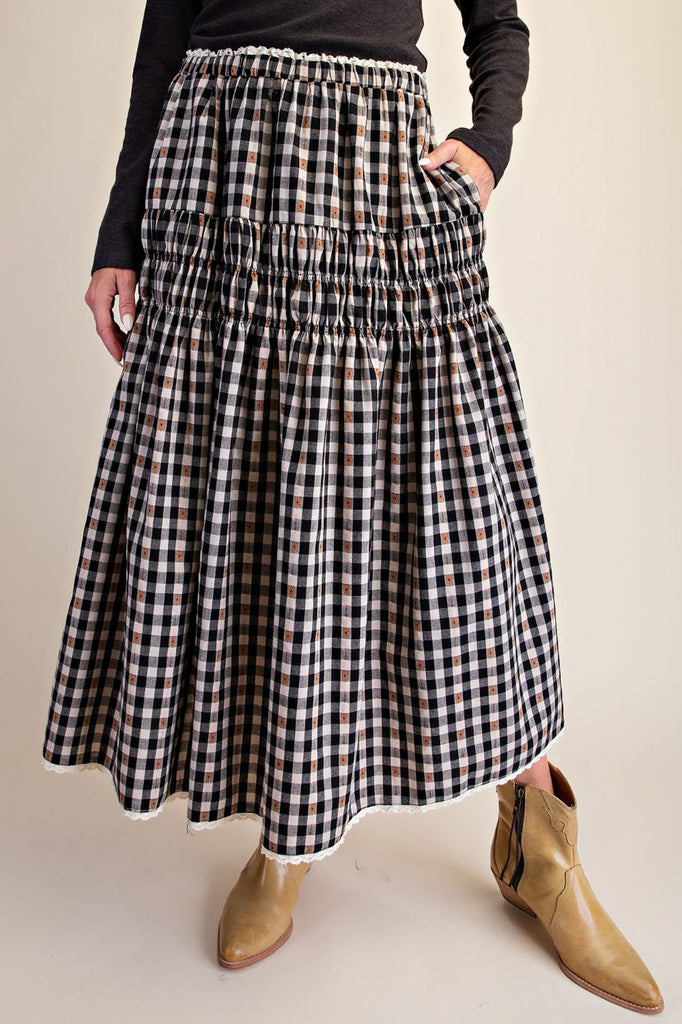 black and white plaid maxi skirt with smocked details and white lace trim. 