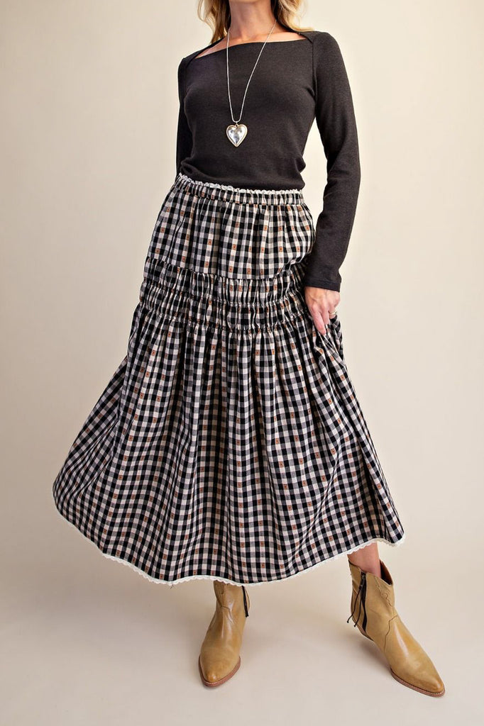 black and white plaid maxi skirt with smocked details and white lace trim. 