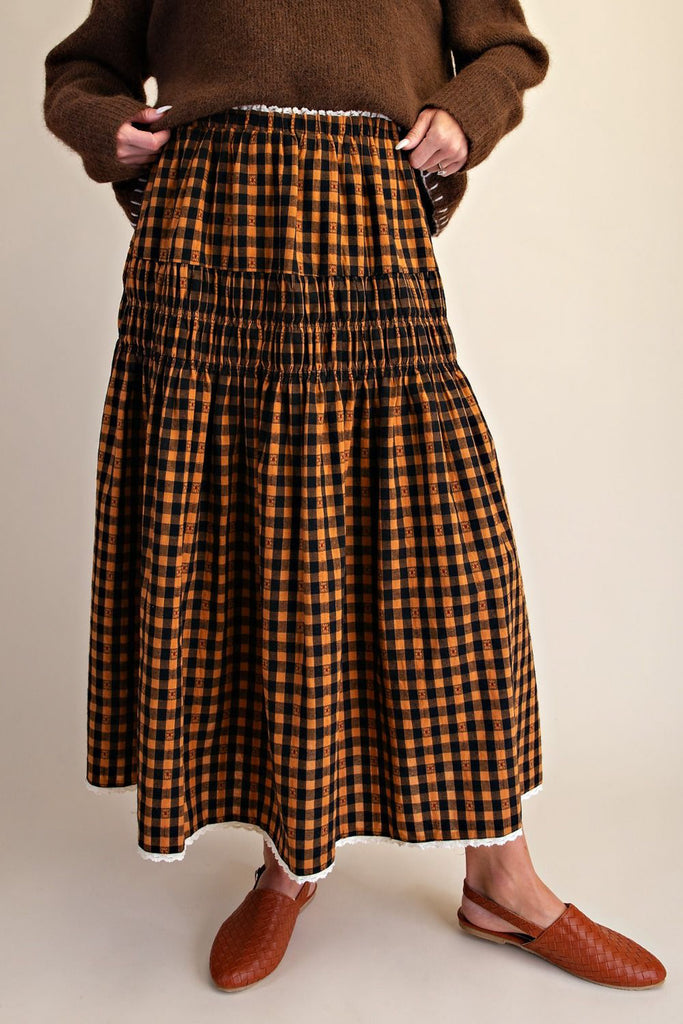 brown and black plaid maxi skirt with smocked details and lace trim