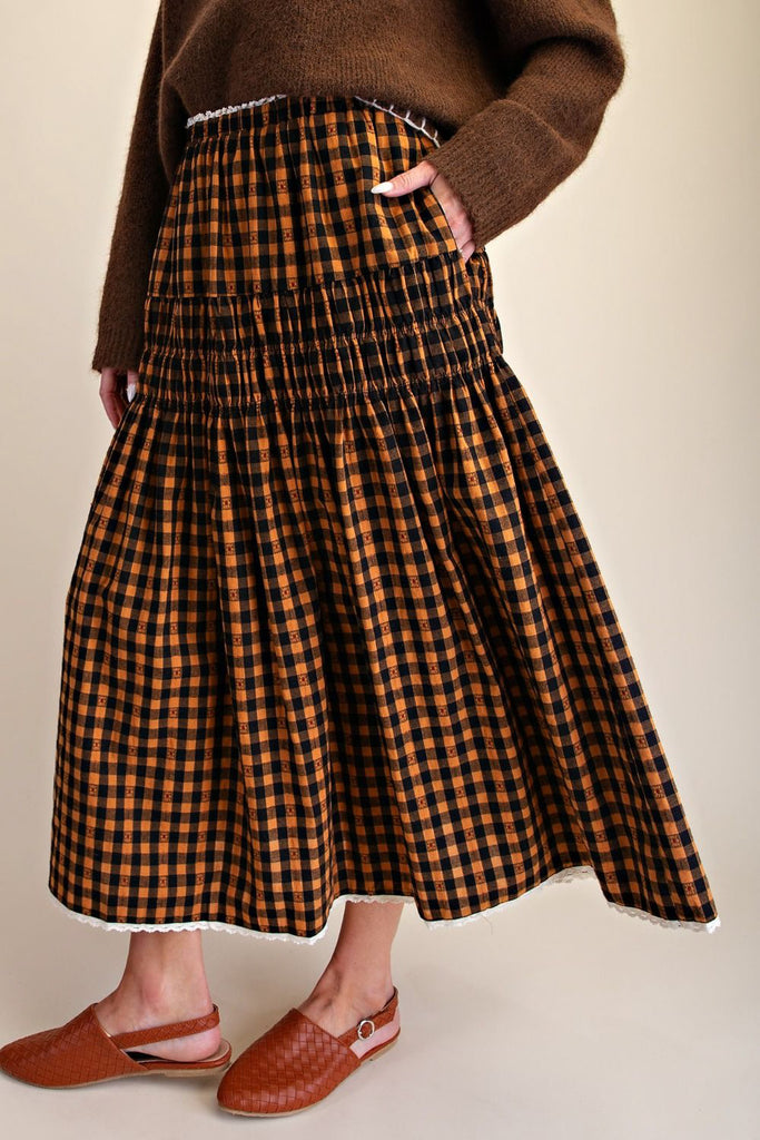 brown and black plaid maxi skirt with smocked details and lace trim