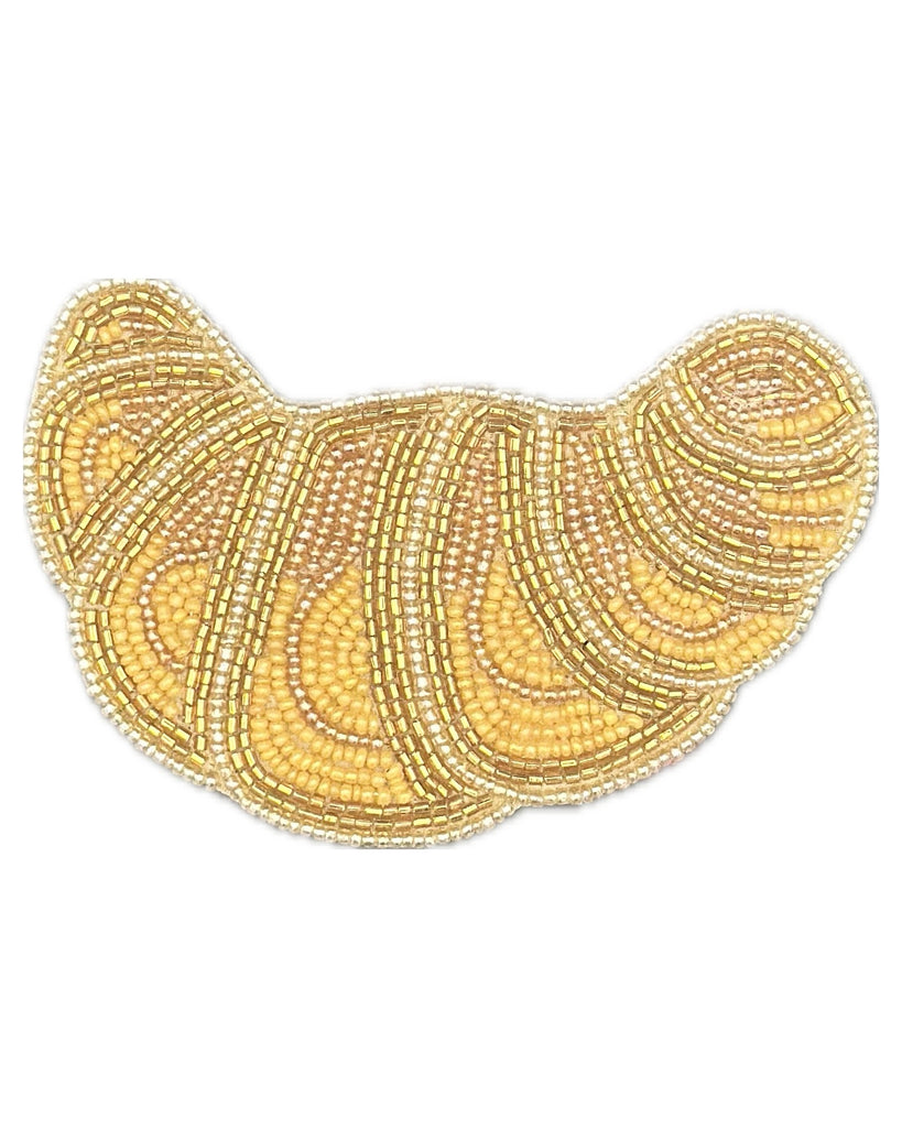 beaded coaster set in the shape of a croissant