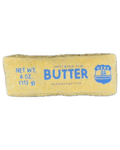 beaded pillow in the shape of a stick of butter