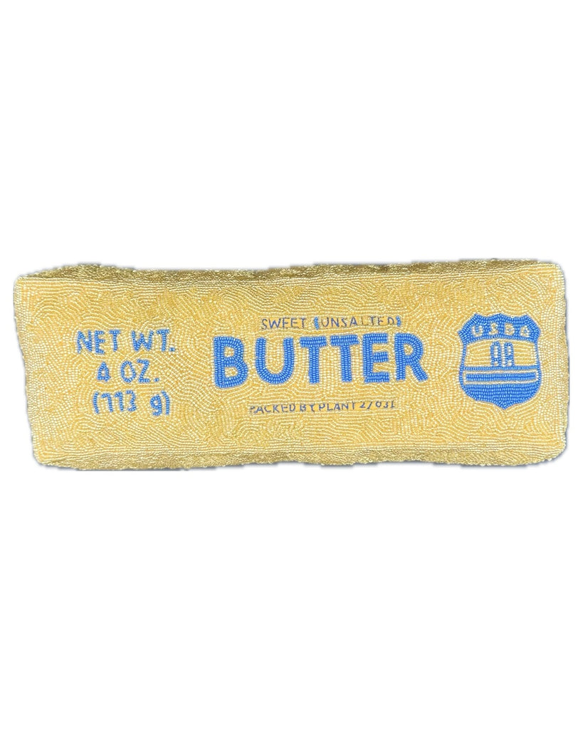 beaded pillow in the shape of a stick of butter