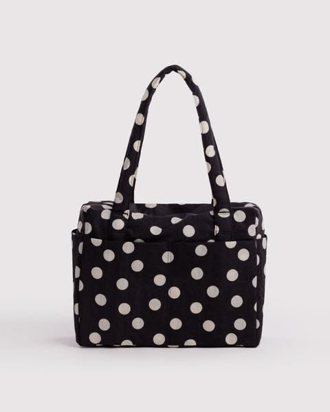 small cloud carry-on bag in black and cream polka dot from baggu