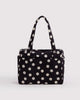 small cloud carry-on bag in black and cream polka dot from baggu