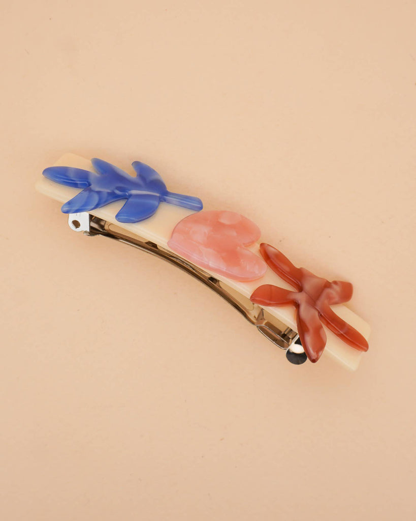 french barrette with striking flowers made from cellulose acetate