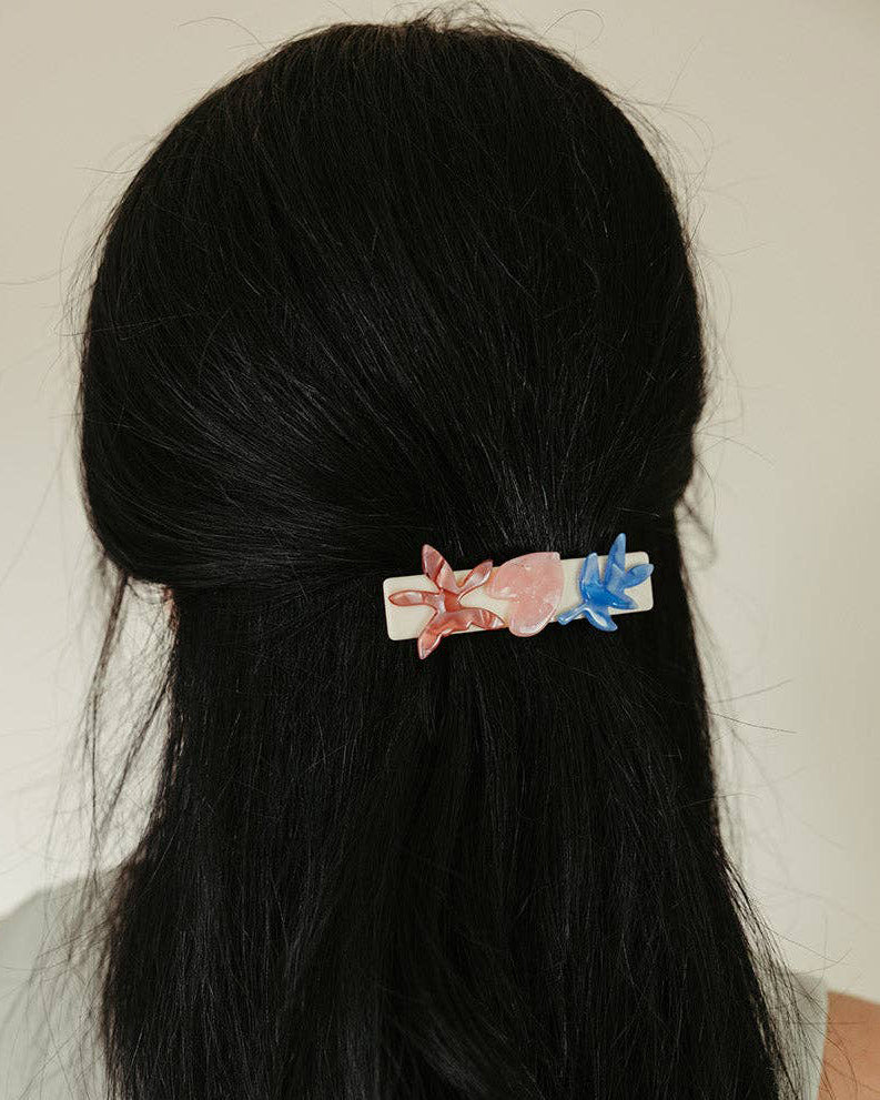 french barrette with striking flowers made from cellulose acetate