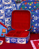 travel jewelry organizer in a blue plaid floral pattern and red faux suede lining