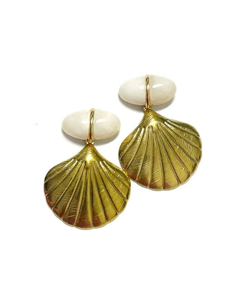 A pair of gold-toned shell-shaped drop earrings with oval white stone tops, displayed on a clean white background.
