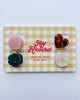 set of mini hair claws with a button-inspired design