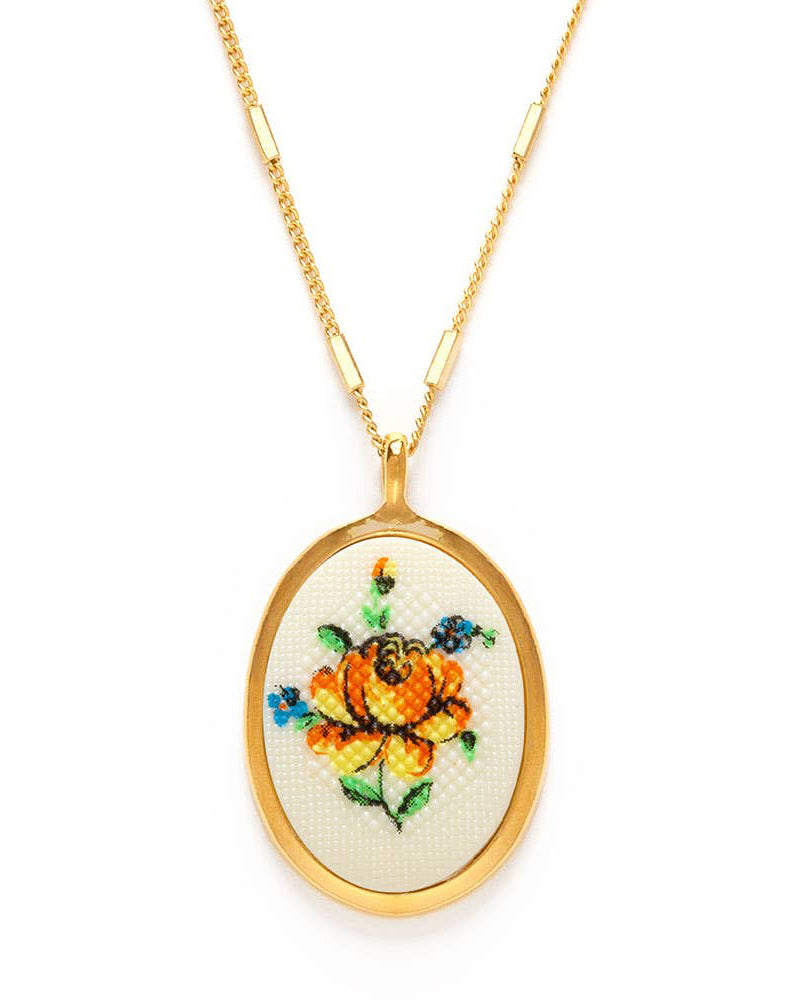 vintage-inspired cameo necklace, needlepoint yellow flower