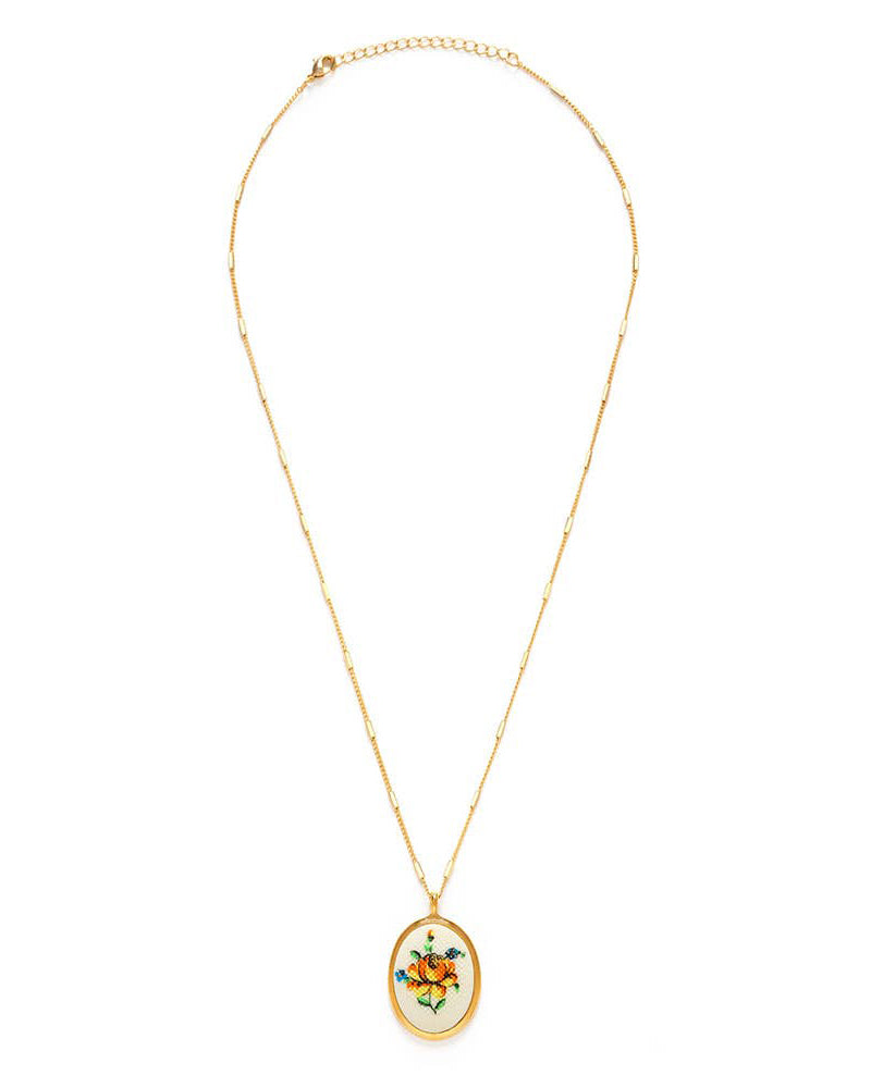 vintage-inspired cameo necklace, needlepoint yellow flower