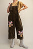 oversized olive green corduroy overalls with patchwork flower applique details 