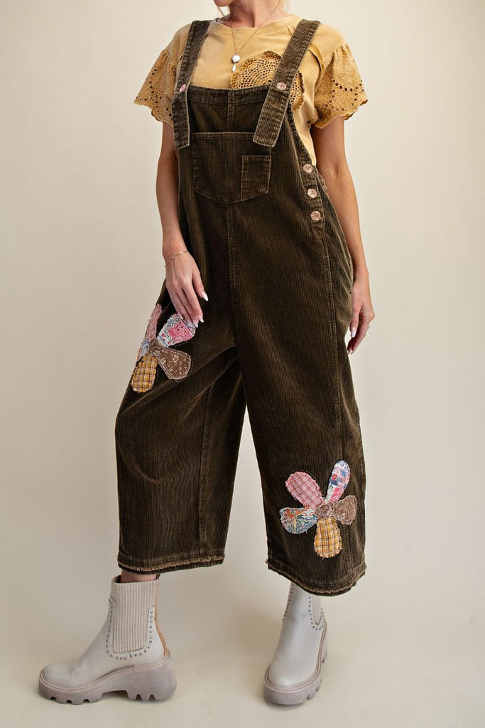 oversized olive green corduroy overalls with patchwork flower applique details 