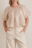 lightweight short sleeve top in shimmery ecru with petite black polka dots throughout.