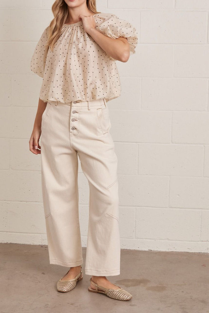 lightweight short sleeve top in shimmery ecru with petite black polka dots throughout.