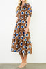 striking midi dress in a bold brown, blue, and white floral pattern