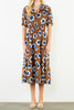 striking midi dress in a bold brown, blue, and white floral pattern