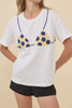 classic white tee with a cheeky beaded bikini design