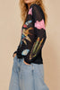 sheer mesh long sleeve top in black with a colorful celestial design