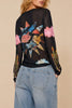 sheer mesh long sleeve top in black with a colorful celestial design