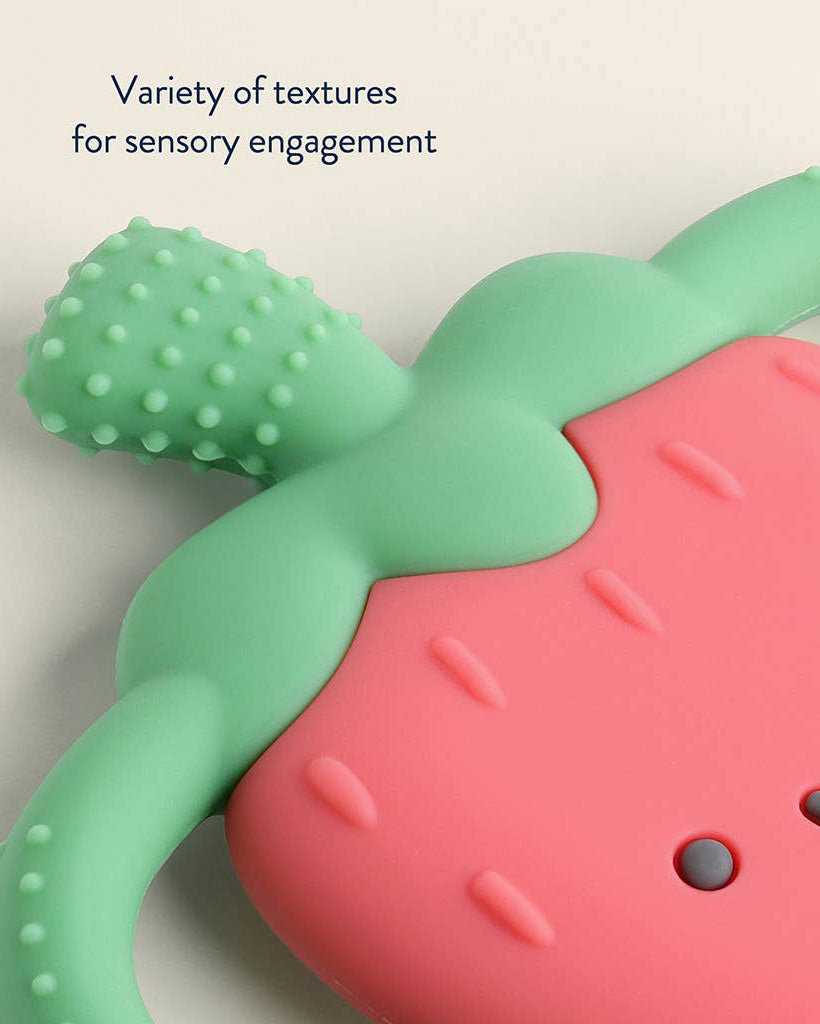 teething toy in the shape of a strawberry