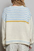 roomy chenille henley-style pullover with orange slice applique details on front.