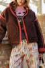 chocolate brown fleece jacket with bold red contrast trim