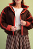 chocolate brown fleece jacket with bold red contrast trim
