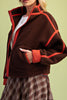 chocolate brown fleece jacket with bold red contrast trim
