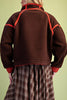 chocolate brown fleece jacket with bold red contrast trim