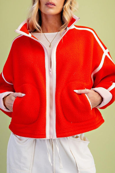 fiery red fleece jacket with white contrast trim