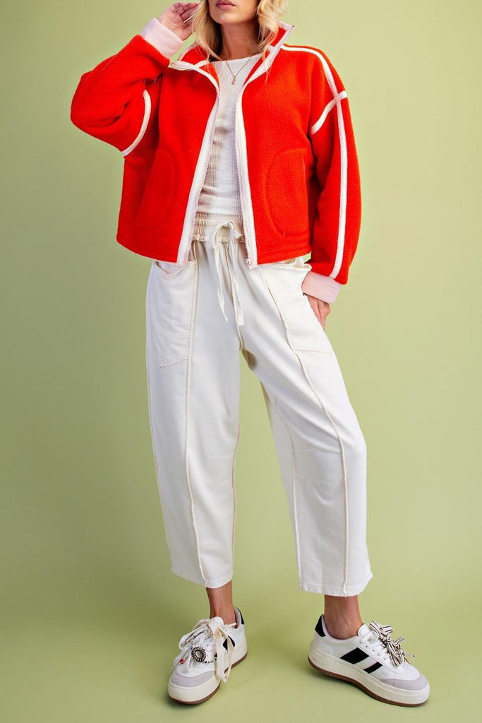 fiery red fleece jacket with white contrast trim
