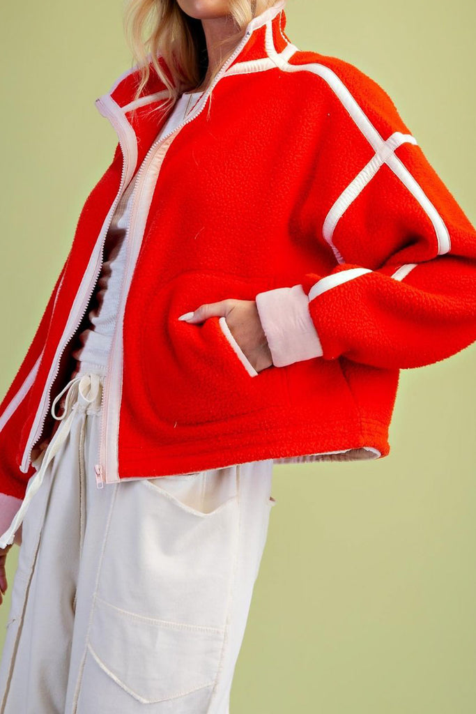 fiery red fleece jacket with white contrast trim