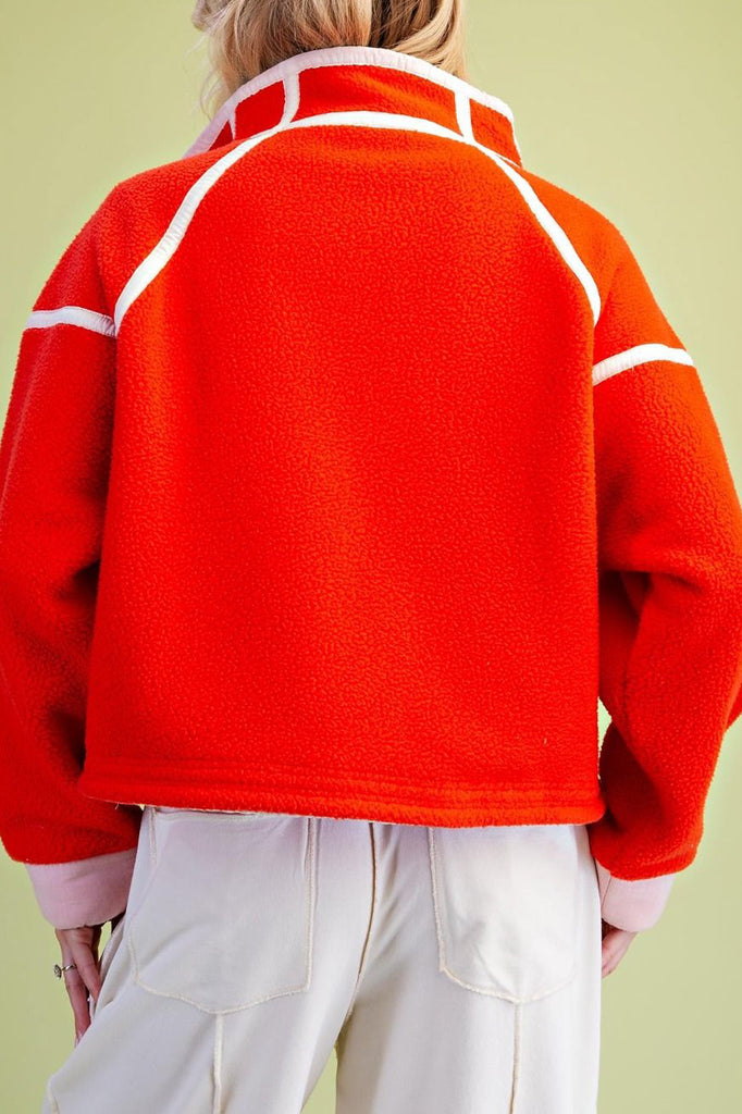 fiery red fleece jacket with white contrast trim
