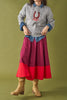 a-line midi skirt with a color blocked design in poppy red and burgundy