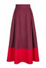 a-line midi skirt with a color blocked design in poppy red and burgundy