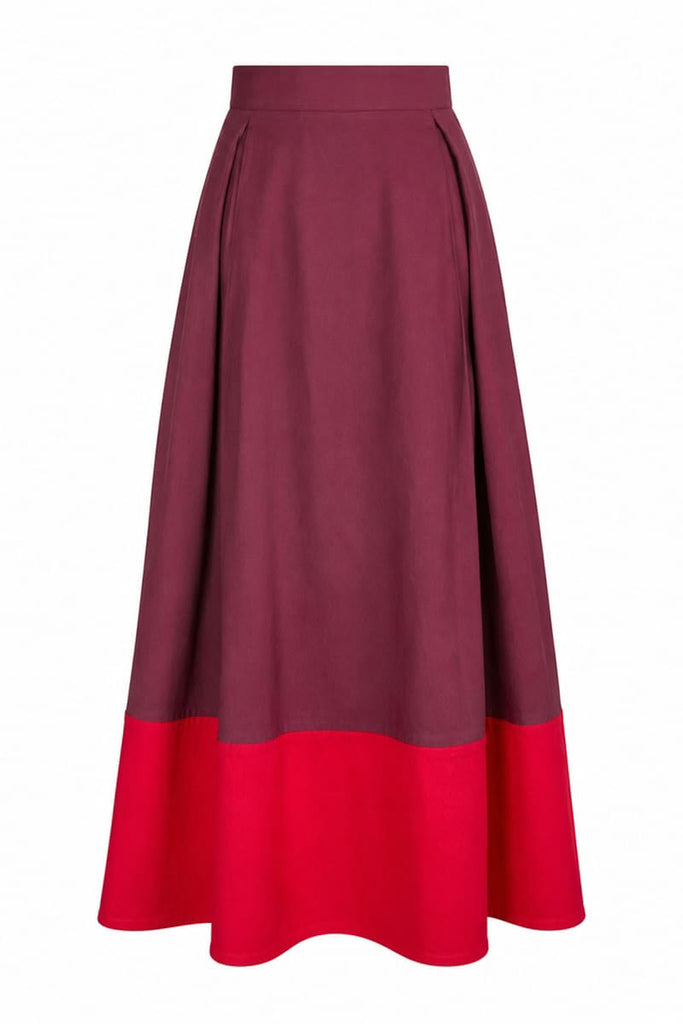 a-line midi skirt with a color blocked design in poppy red and burgundy