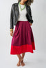a-line midi skirt with a color blocked design in poppy red and burgundy