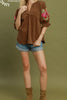 camel brown corduroy top with colorful embroidered floral details on sleeves.